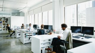 Office workers in a well-lit office space