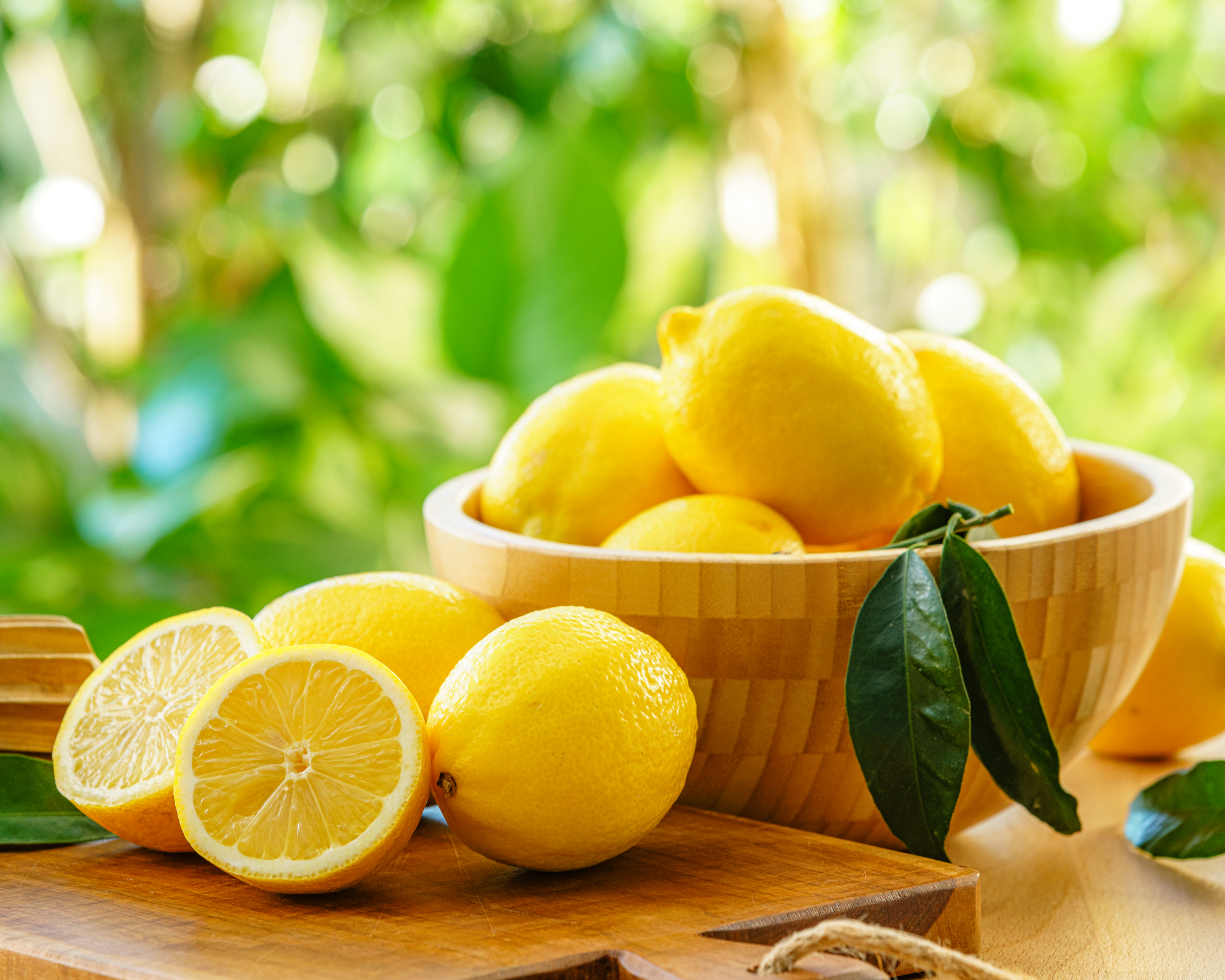 Ripe lemons composition shot on garden table