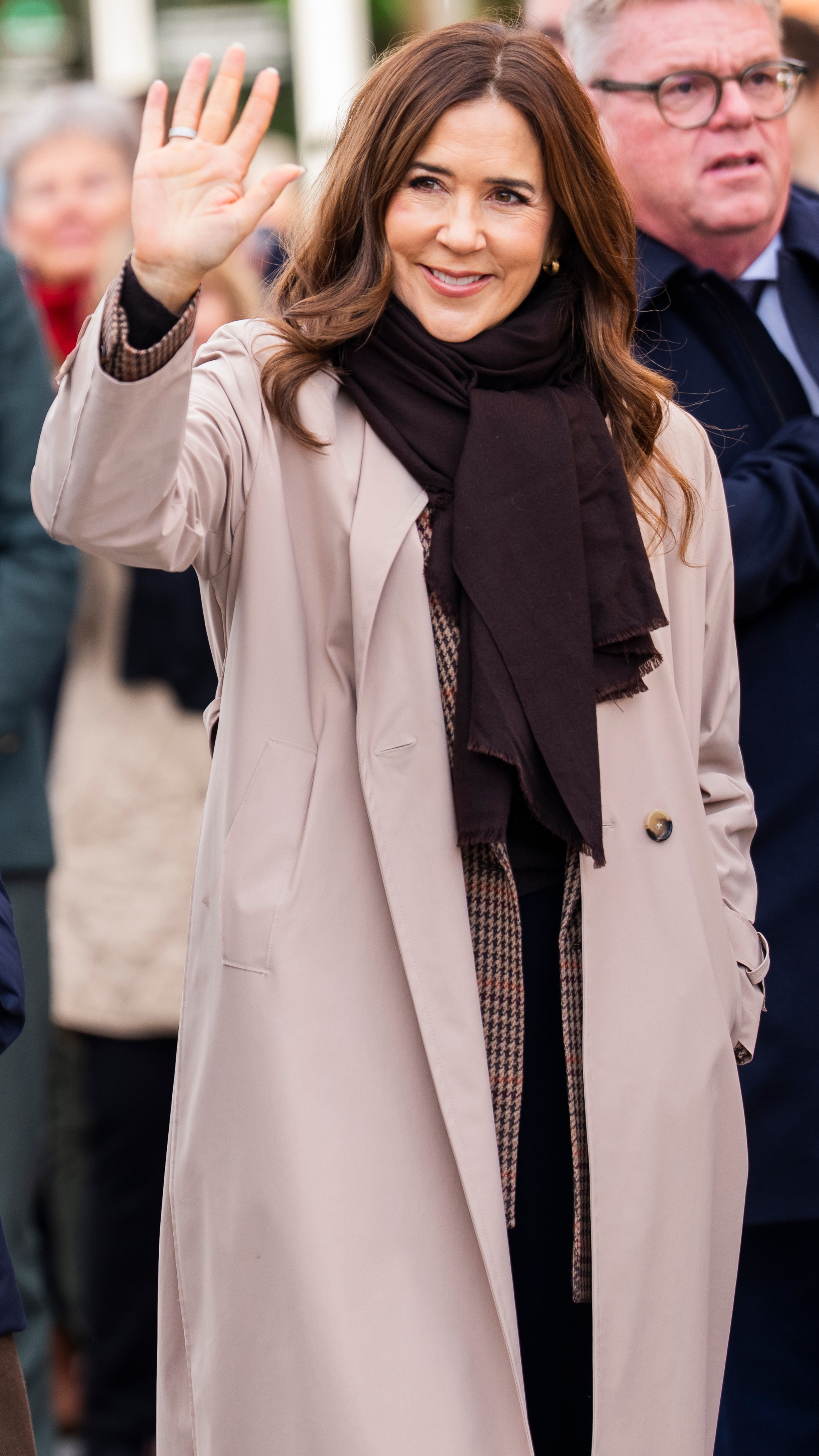 Queen Mary of Denmark waves during a walk on October 27, 2025