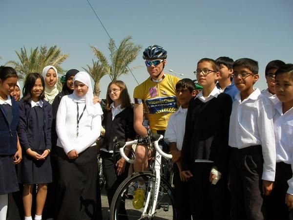 Race leader Mol poses with some local school children.