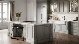 Luxury kitchen with a central island unit and herringbone pattern wooden floor