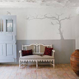 white and grey wall with tree shadow painting white seat and cushion