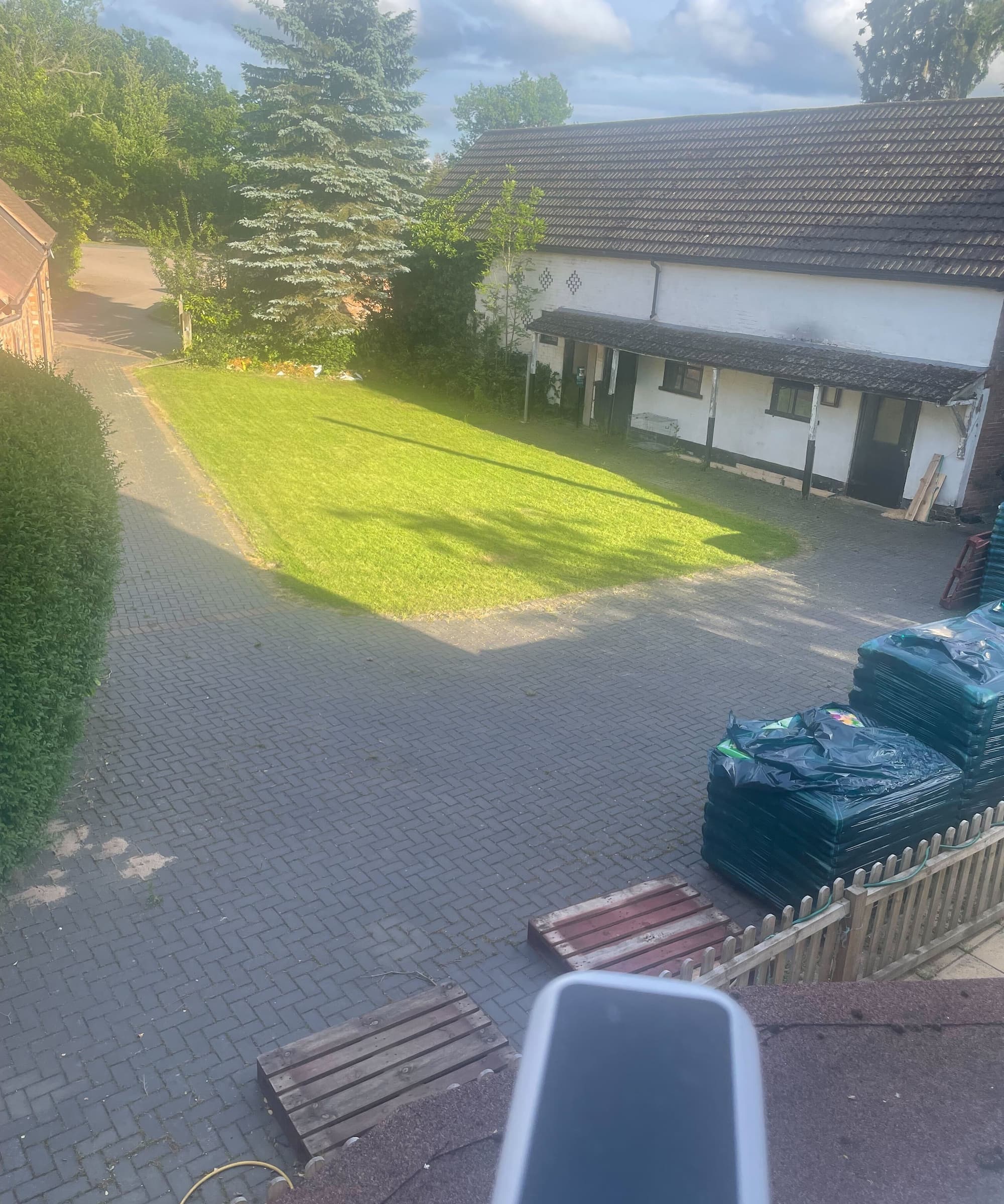 A security camera overlooking a back lawn