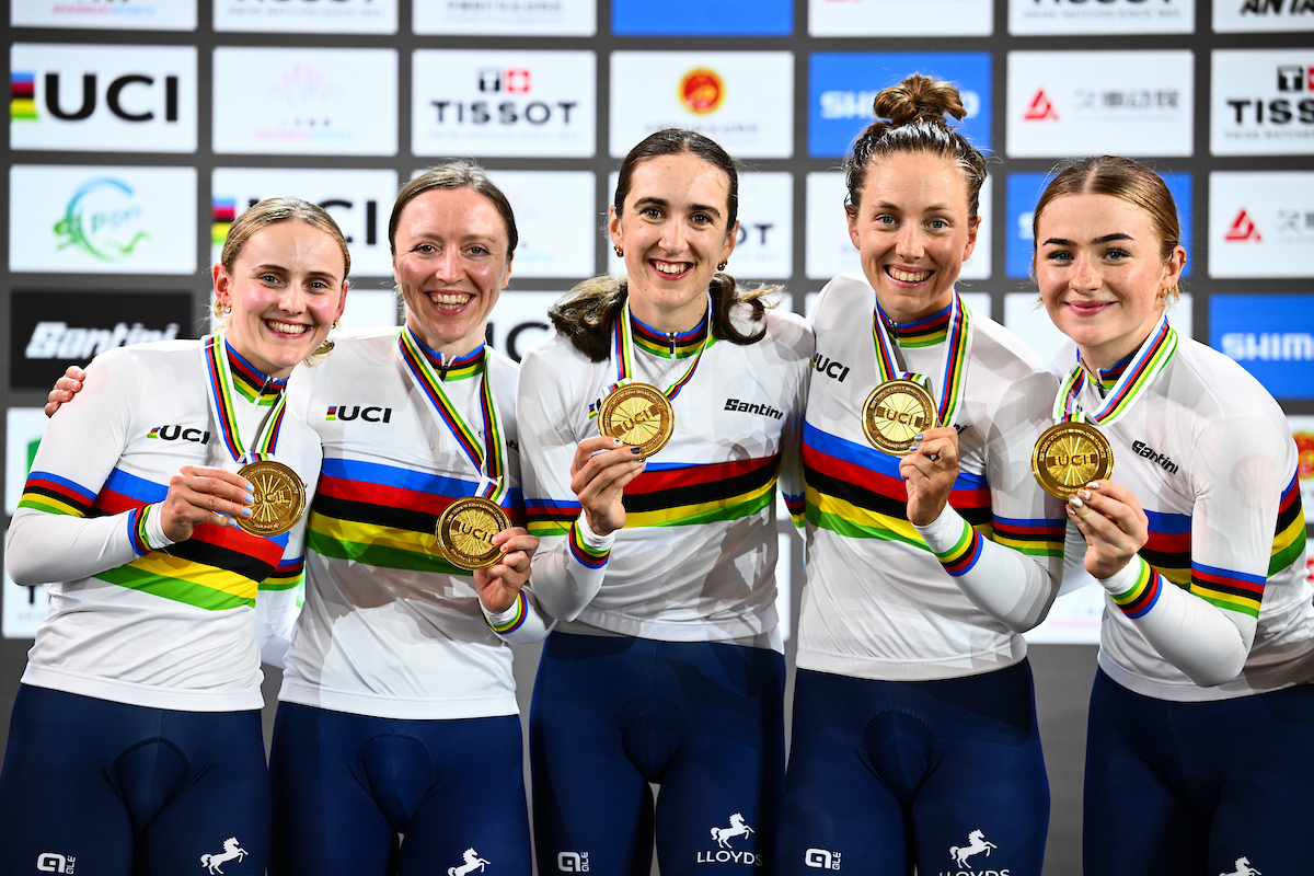 The British women in rainbow jerseys with gold medals