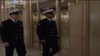 Robert De Niro and Cuba Gooding, Jr. in Navy uniforms walking in a hallway