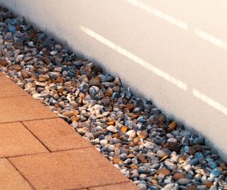 patio drainage with gravel filled french drain