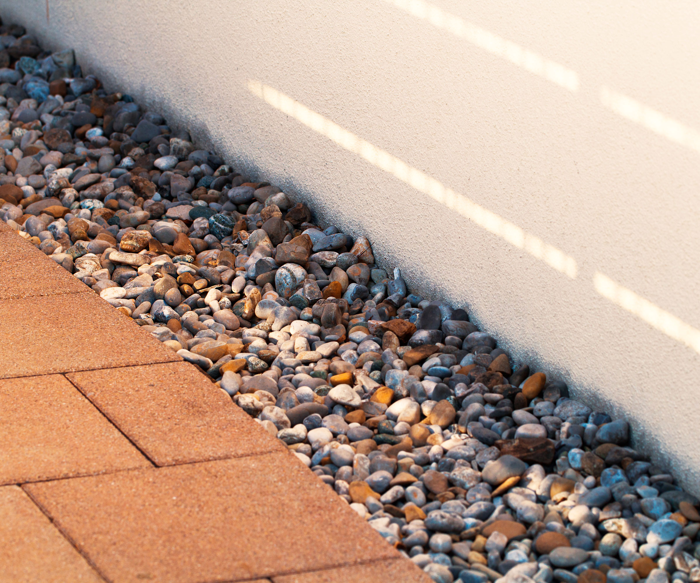 patio drainage with gravel filled french drain
