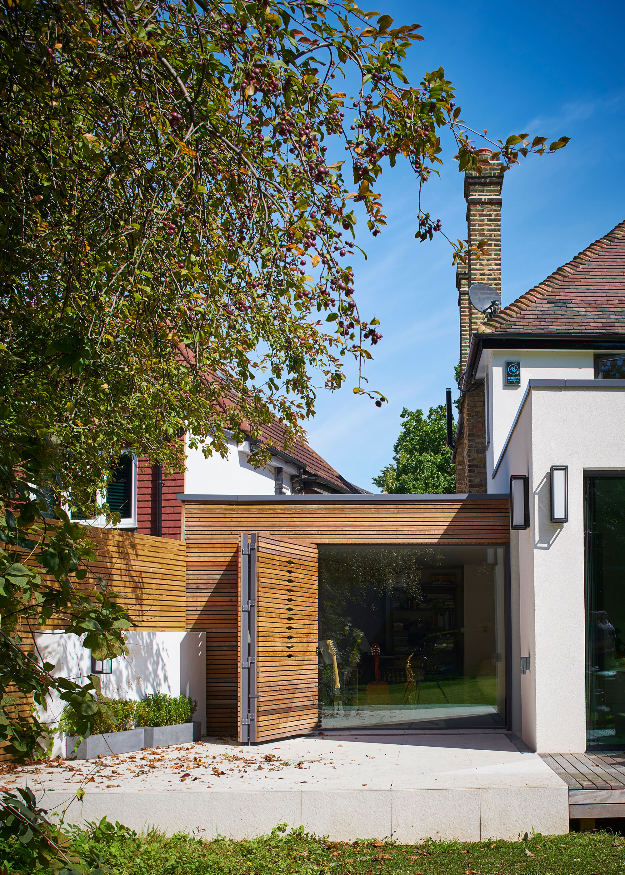modern side extension with timber sliding external shutters