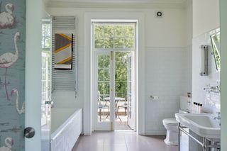bathroom with balcony and flamingo wallpaper