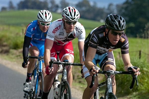 Samuel Davis (Plan B Racing) drives Luke Fetch (Search2Retain) from Victoria and Russian Valery Valynin (Team Russia) towards the finish in Penguin. The trio opened up a gap on the peloton with around twenty kilometres remaining.