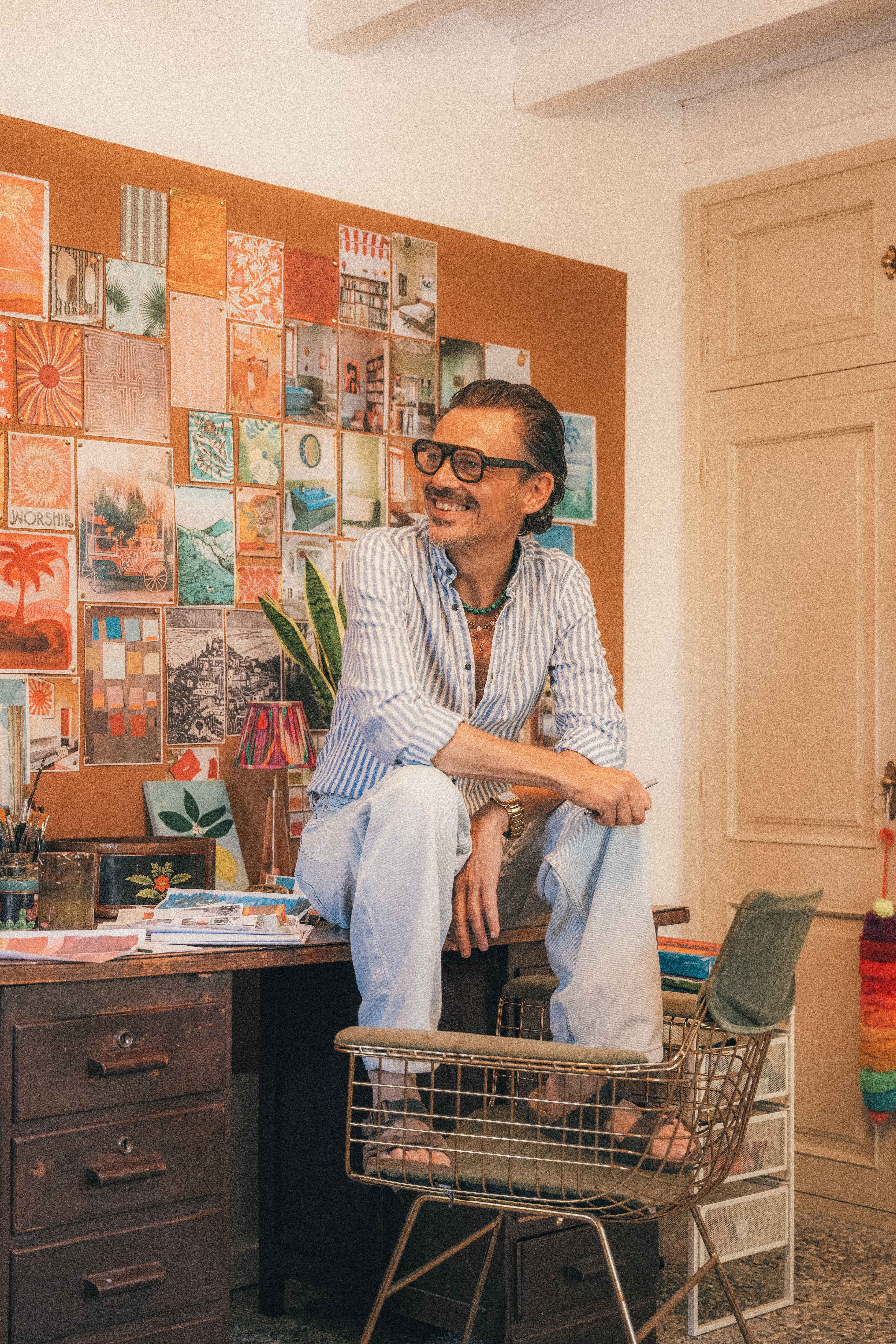 Matthew Williamson, the designer of the Brit Awards 2026 trophy, sitting on a desk in his studio