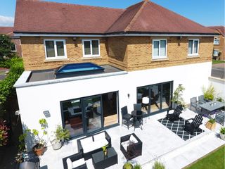 Bi-fold doors and roof lanterns let in the light and connect to the garden