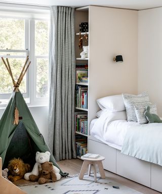 kid's room with green wigwam, joinery and an integrated bed space