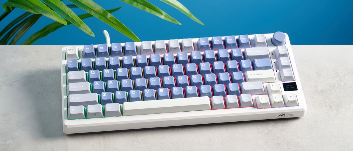 A Royal Kludge M75 wireless mechanical keyboard with blue keycaps