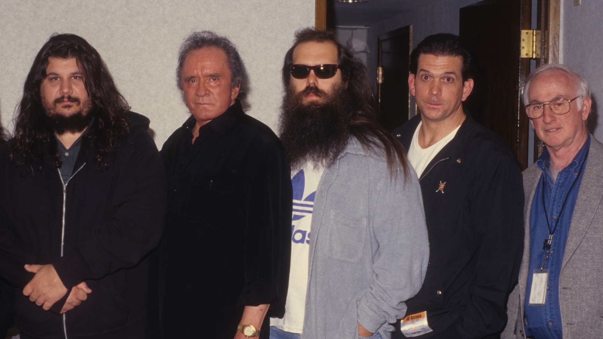 Johnny Cash poses with Rick Rubin, Lou Robin and others backstage at the Greek Theatre in Los Angeles, California on June 14, 1997