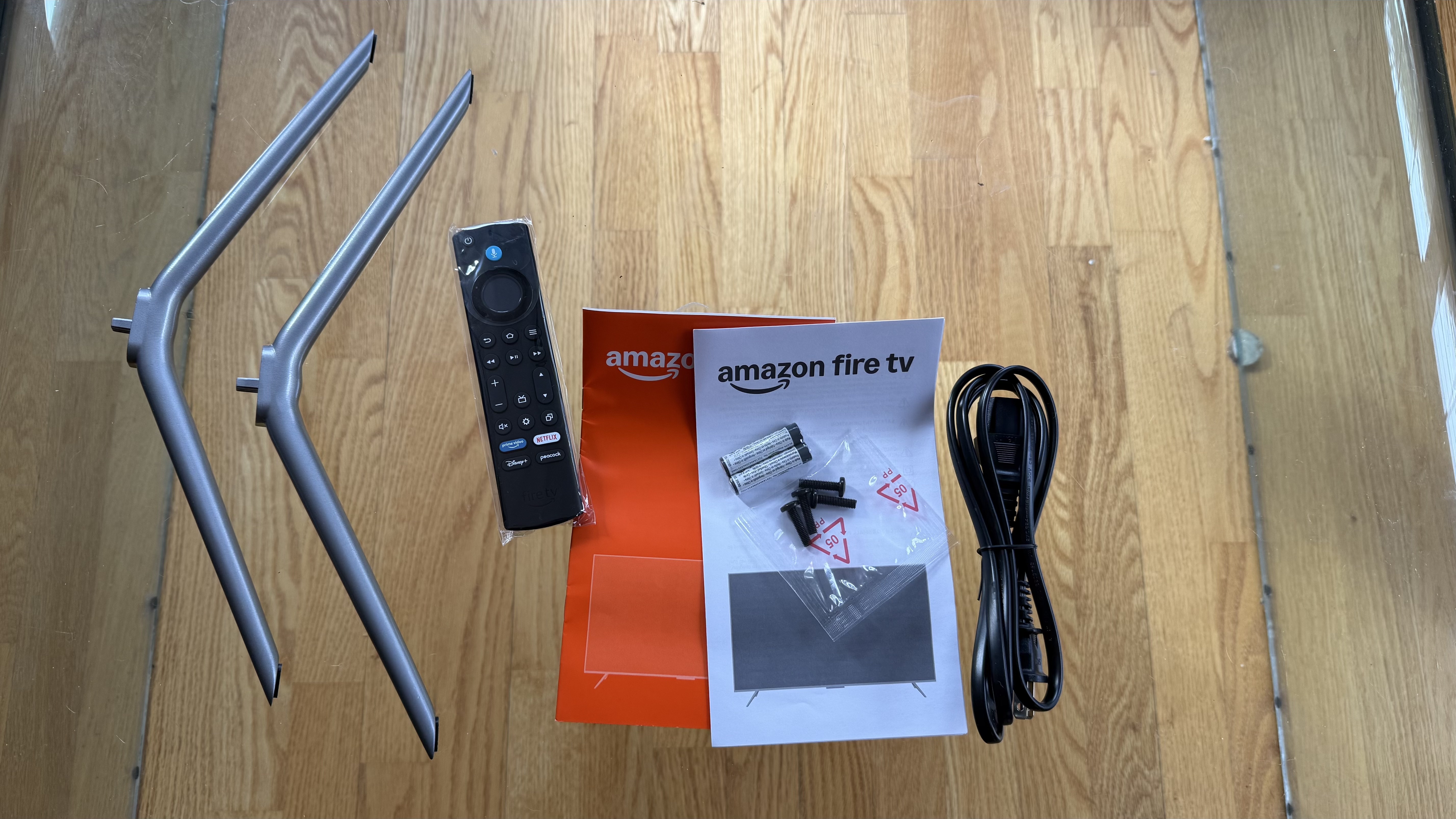 Amazon Fire TV Omni QLED (2025) accessories on floor