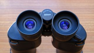 The eyecups and zoom level of the Nikon Action Zoom 10-22x50 binoculars.