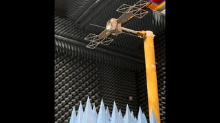 A small-scale model of the European Jupiter Icy Moons Explorer is being used in this image to test a novel radar instrument that will enable the probe to see miles below the surface of Jupiter's moons.