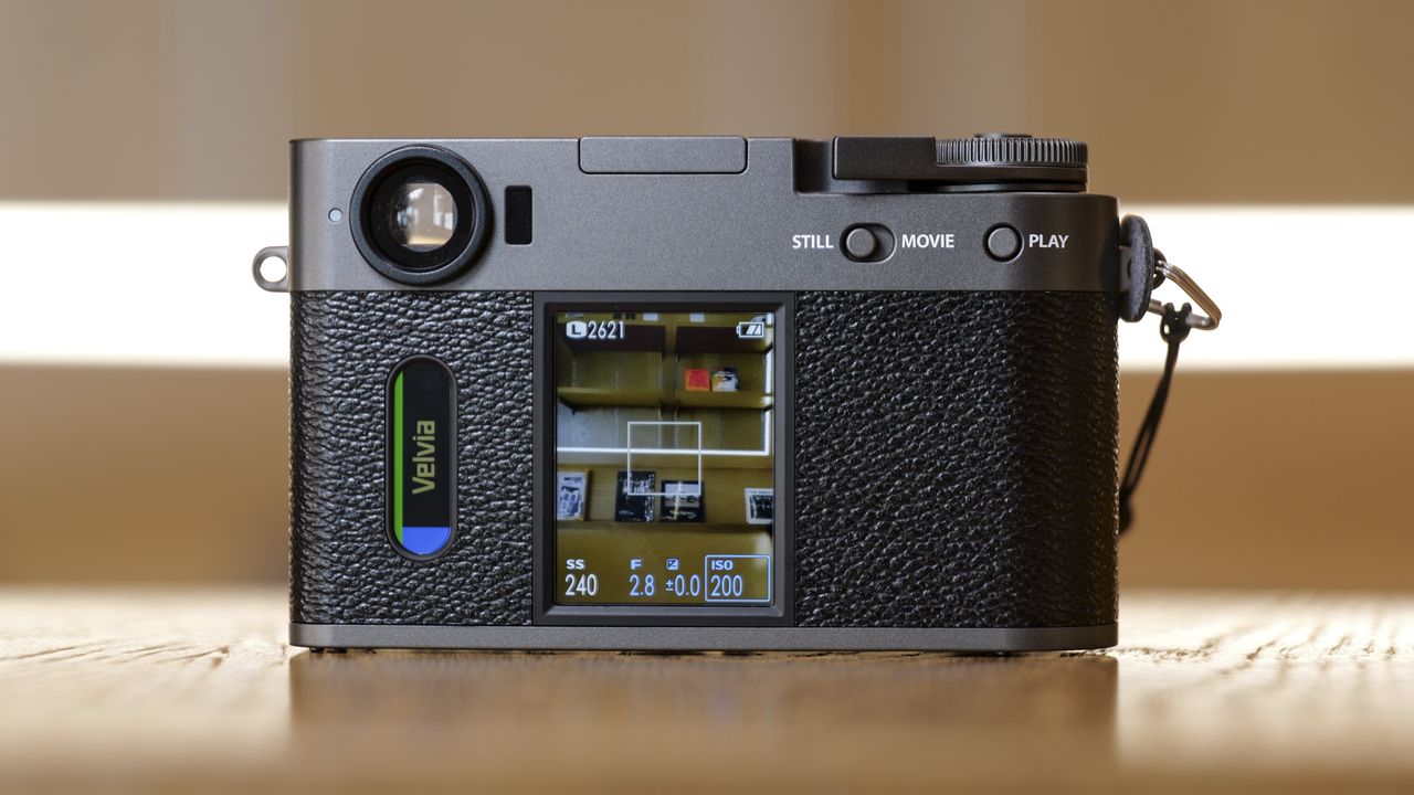 Fujifilm X half compact camera's back, on a wooden surface