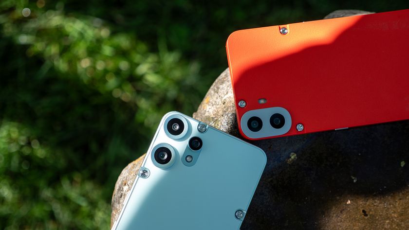 Comparing the backs and camera lenses of the orange CMF Phone 1 to the teal CMF Phone 2 Pro
