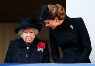 A close up of the Queen with her five poppies and Kate Middleton