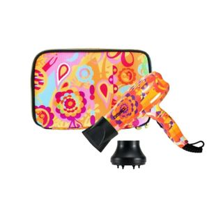 The amika mighty mini hairdryer with an orange floral pattern, black diffuser and travel bag