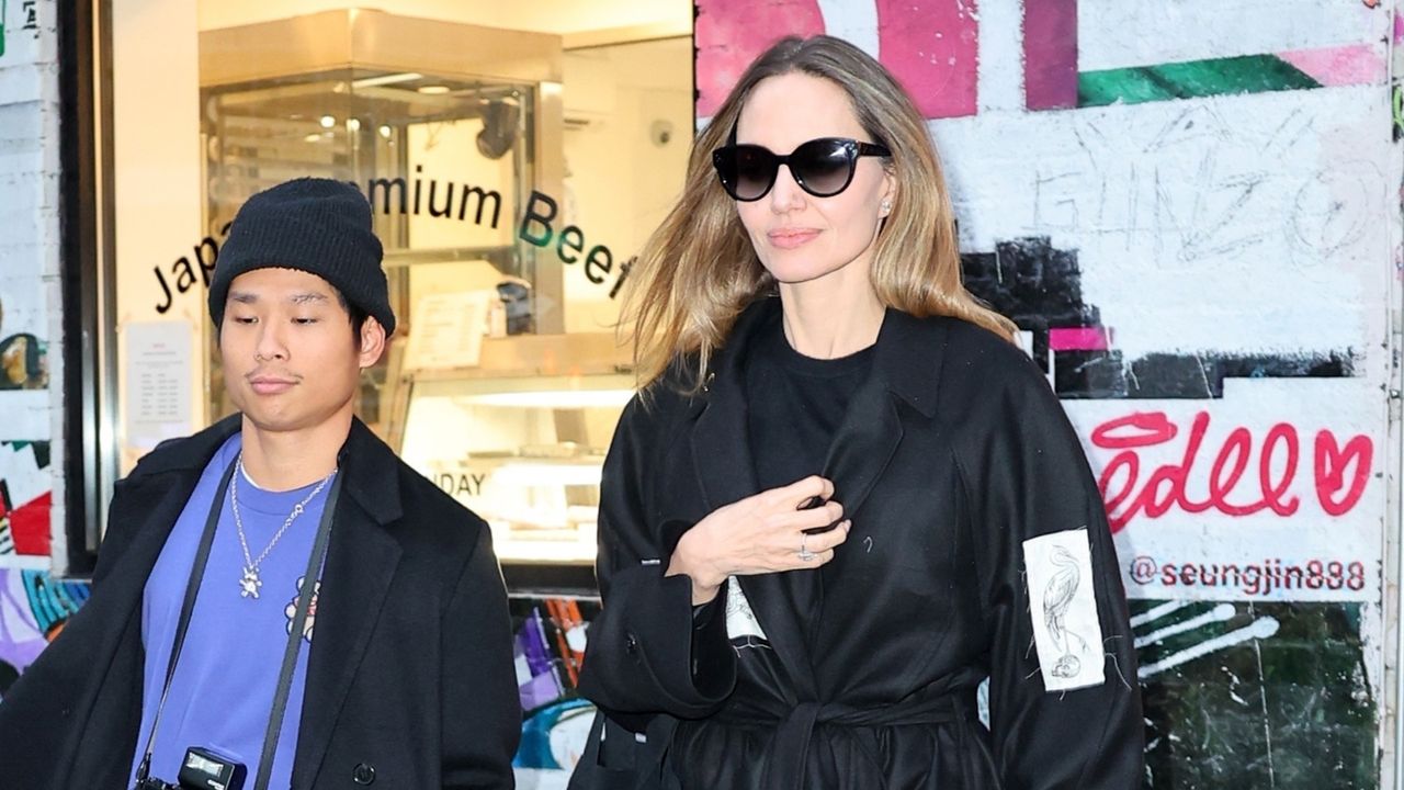 Angelina Jolie wearing an all-black outfit with her son Pax