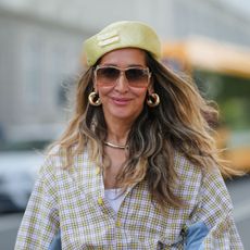 street style shot of woman with thick wavy hair - best shampoo for hair loss