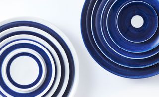 Bowls and plates are all hand painted with simple blue indigo line