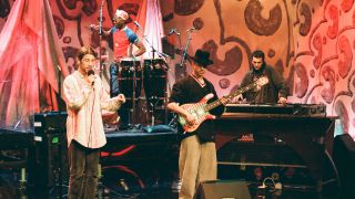 THE TONIGHT SHOW WITH JAY LENO -- Episode 1150 -- Pictured: (l-r) Musical guest Jay Kay, Sola Akingbola (back left), Stuart Zender, and Darren Galea (back right) of Jamiroquai perform on May 16, 1997