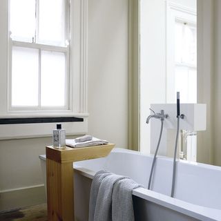 bathroom with bathtub and towel