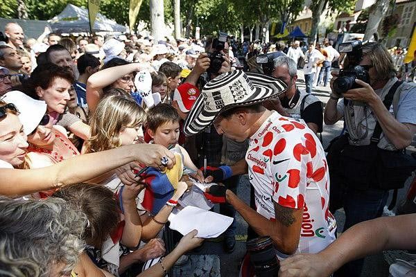 The polka dot with sun protection signs autographs before the stage.