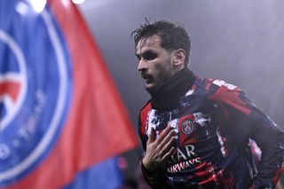 Khvicha Kvaratskhelia warms up ahead of a game for Paris Saint-Germain against Stade de Reims in January 2025.