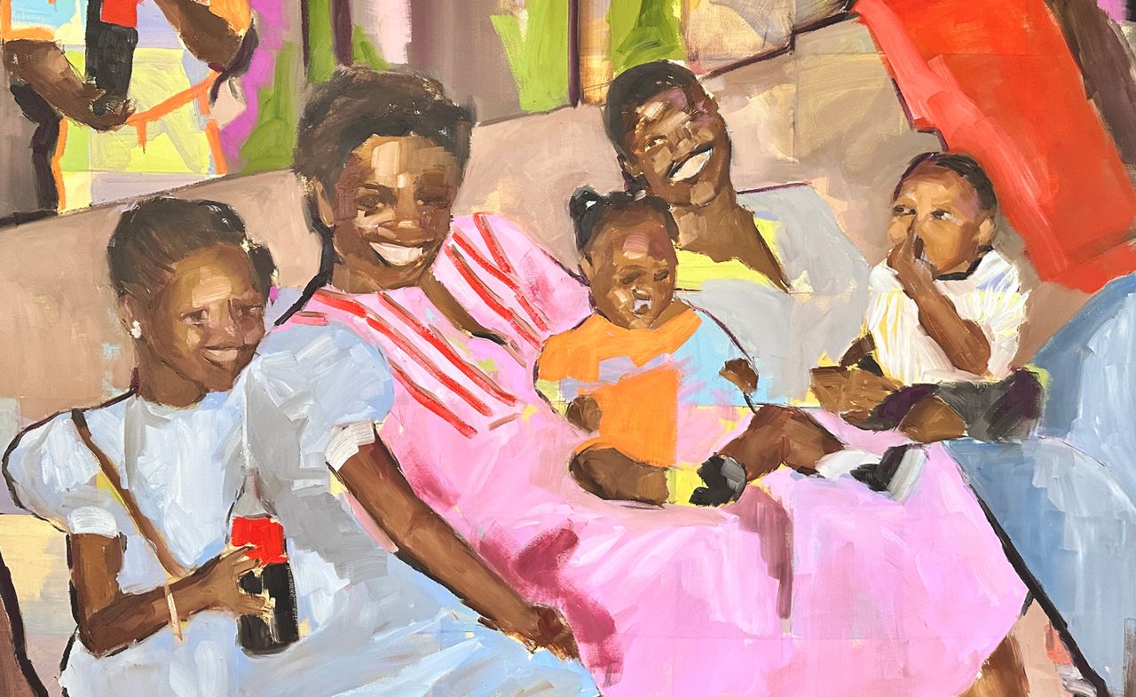 Portrait of Black family on sofa