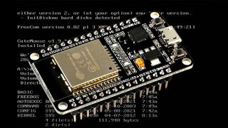 An ESP32 in front of a DOS screen