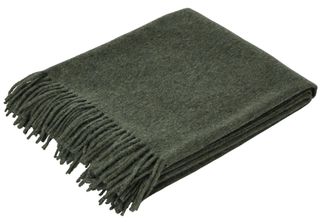 Oka’s Pacos throw, made in an Alpaca and wool blend, in moss — £275 from www.oka.com