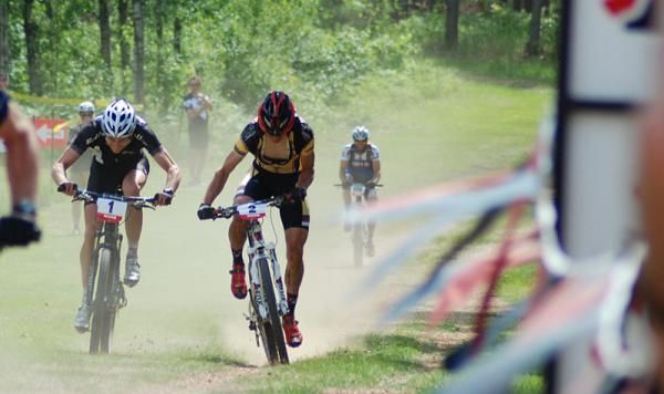 Defending Overall Champ Tristan Schouten (Rolf Prima / Giant, #1, left) sprints current Series Leader Brian Matter (Gear Grinder / Trek, #2, right) to the finish of the third race in the 2012 Wisconsin Off Road Series.