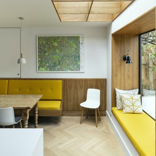 kitchen extension inside with yellow window seat