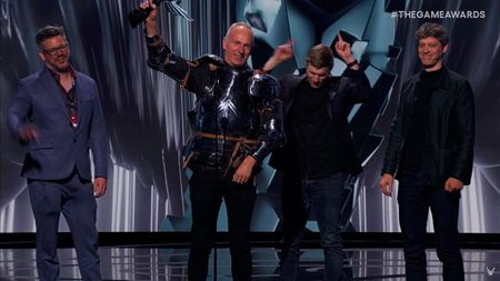 Larian CEO accepts an award for Baldur's Gate 3 while wearing armor