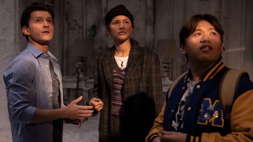 Tom Holland, Zendaya, and Jacob Batalon look up at a light source in an icy chamber in Spider-Man: No Way Home.