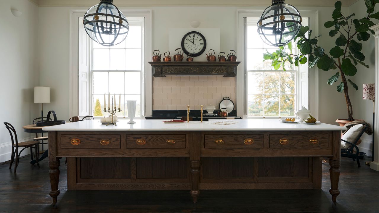 Kitchen island with dark wood island and white marble countertop