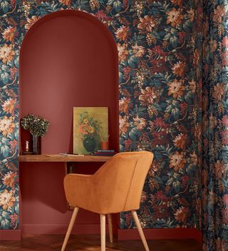 bedroom with floral wallpaper and arch with desk