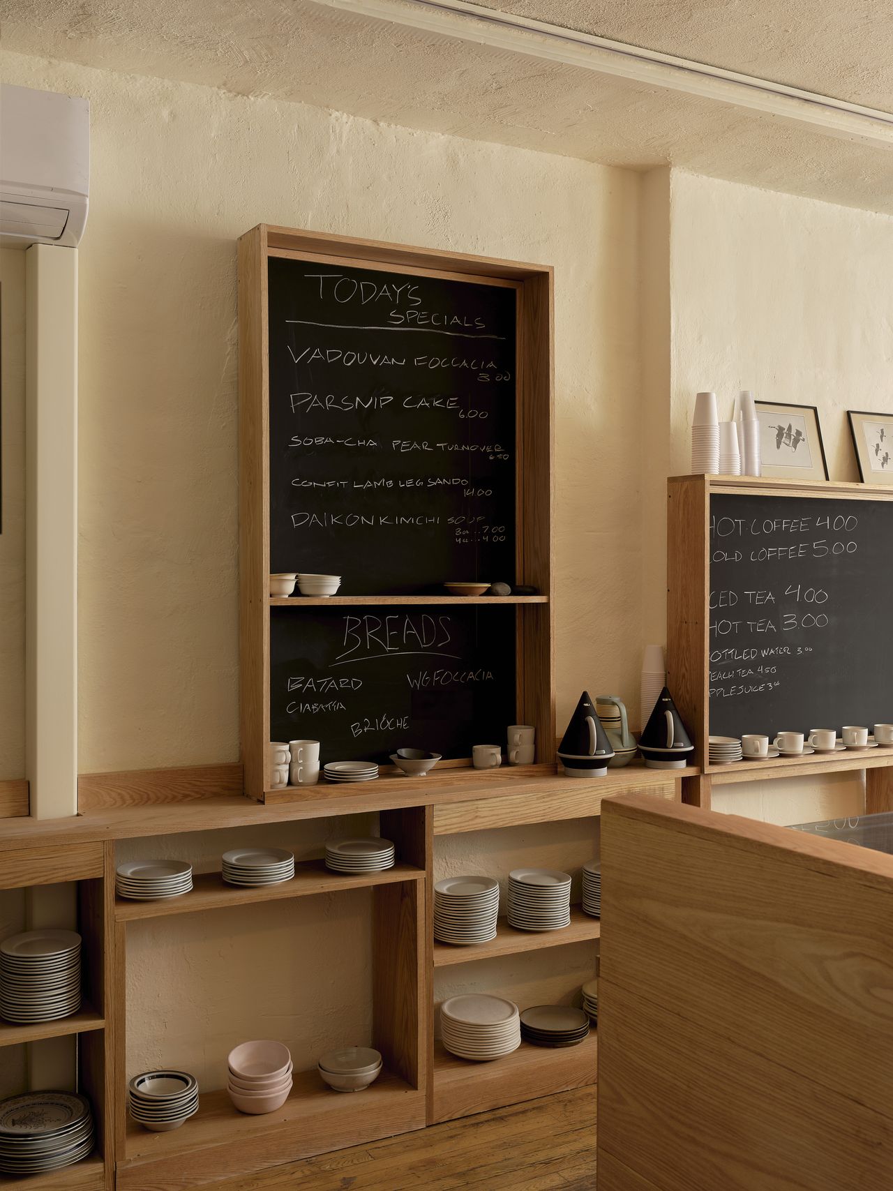 a store filled with ceramics and wooden furniture