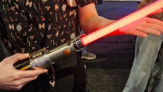 Star Wars Anakin Skywalker Color-Change Lightsaber being held in someone's hands