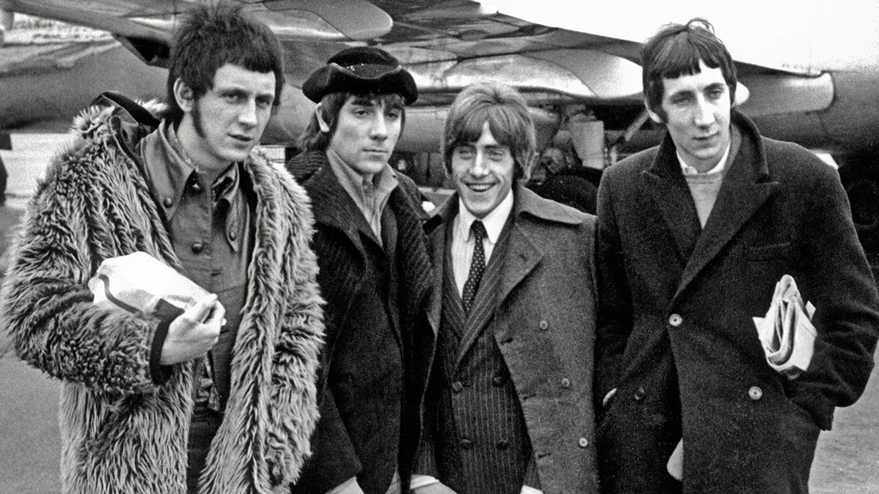 A shot of the who outside a plane