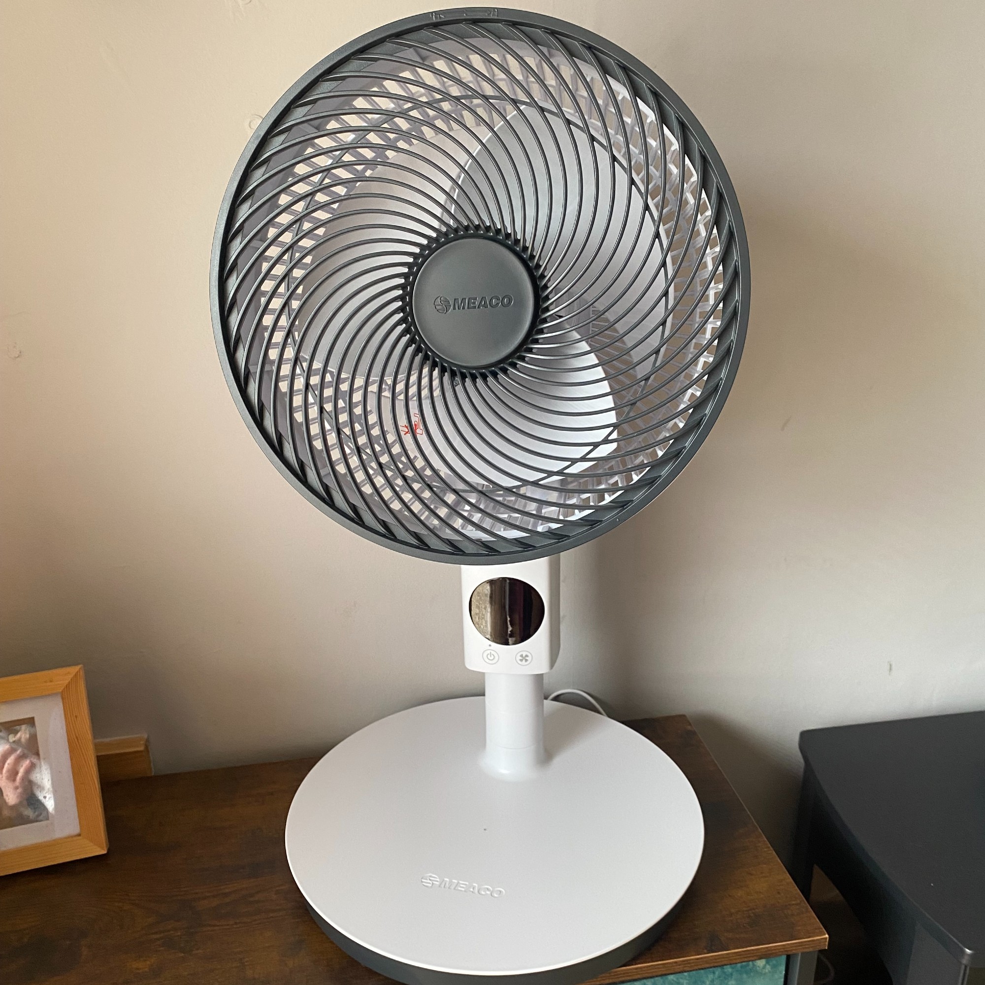 Meaco MeacoFan Sefte 10'' pedestal air circulator fan in table-top mode on a side table