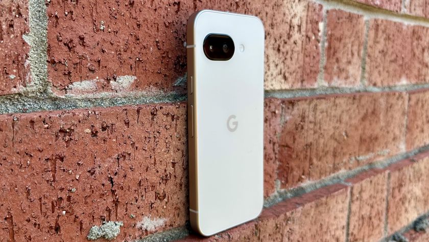 The Google Pixel 9a sitting atop a brick chimney.