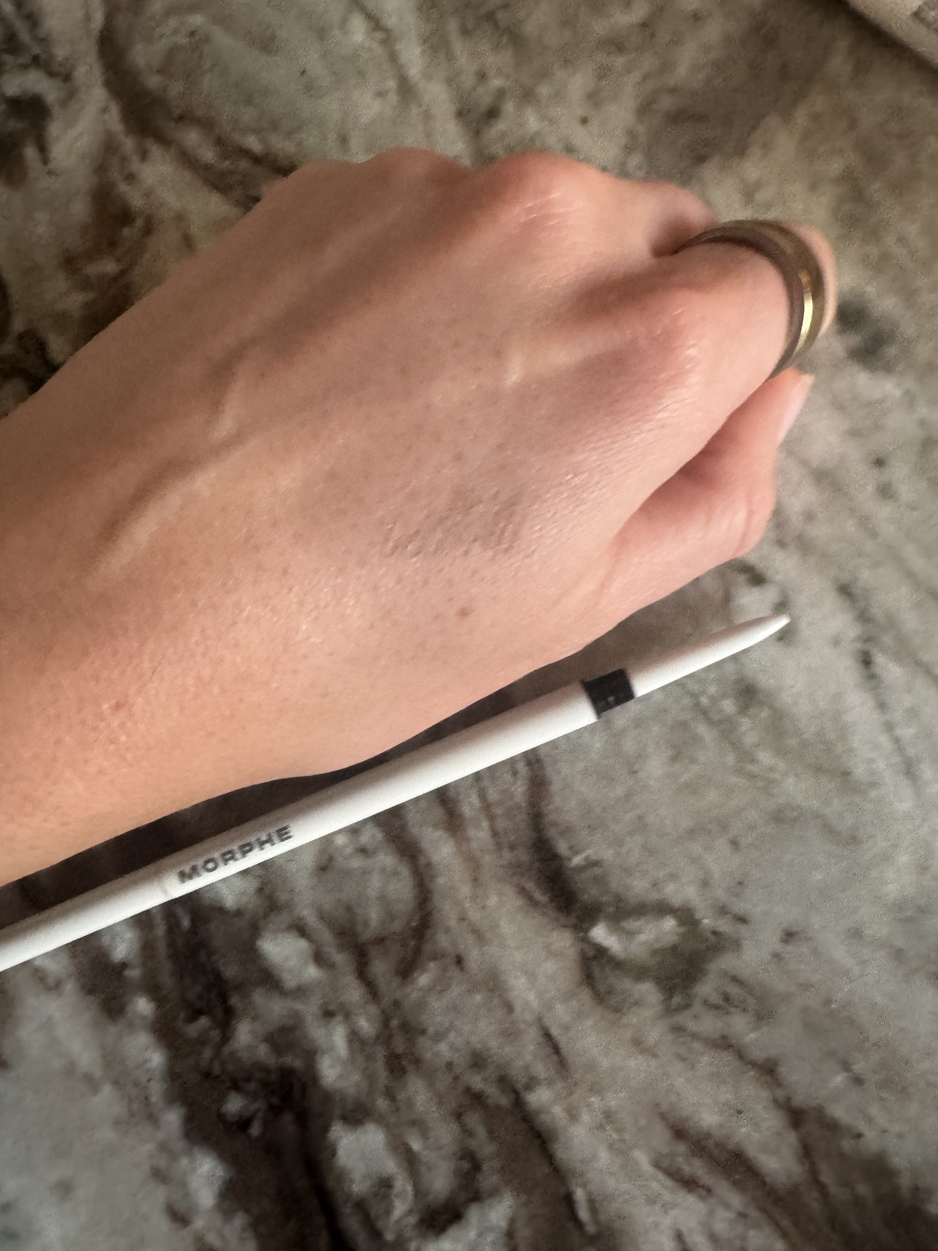 Beauty editor Eleanor swatching the Morphe nano brow pencil on her hand