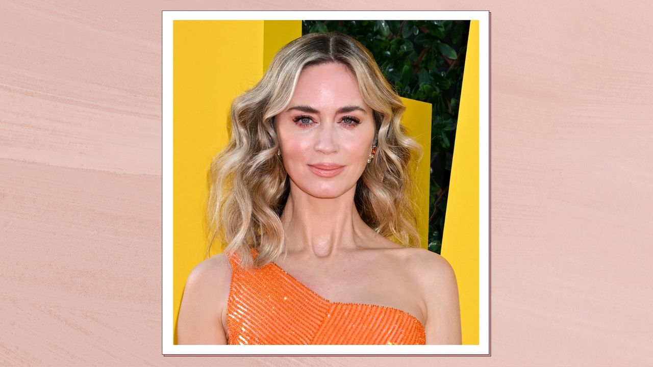 Emily Blunt is pictured with curls and wearing an orange dress at the premiere of &quot;The Fall Guy&quot; held at the TCL Chinese Theatre on April 30, 2024 in Los Angeles, California/ in a pink template