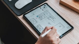 A designer uses one of the best UX resources for wireframing